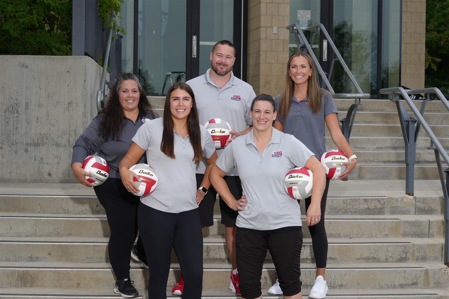 Photo of Volleyball Coaches Standing on Stairs