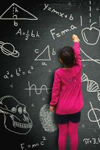 girl doing math on a chalkboard