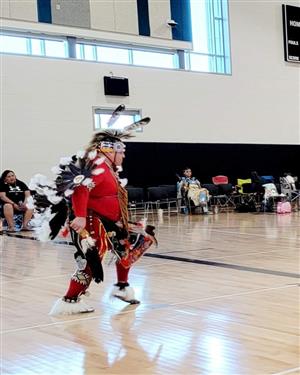 Dancer in red at Powwow
