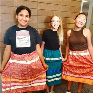 Students in ribbon skirts