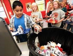 kids throwing trash away
