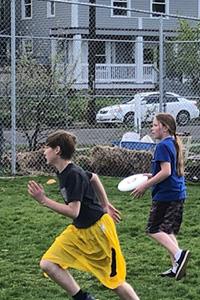 students playing ultimate frisbee