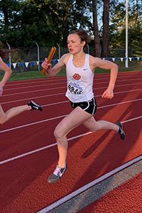 girl running with baton